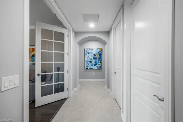 a kitchen with stainless steel appliances granite countertop a stove a chimney a dining table and chairs