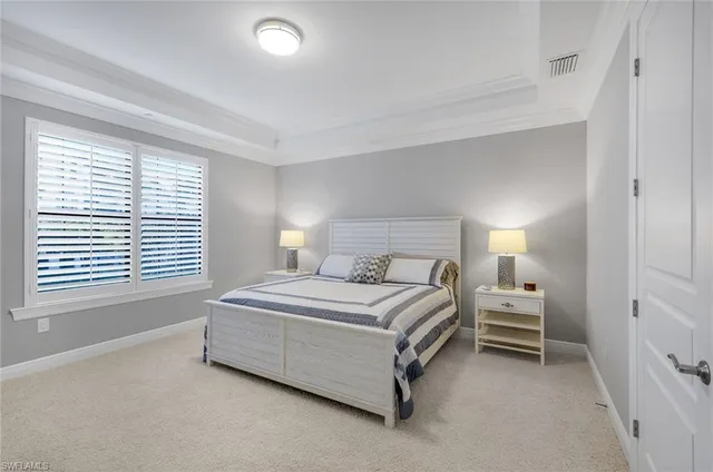 a white bath tub sitting next to a shower