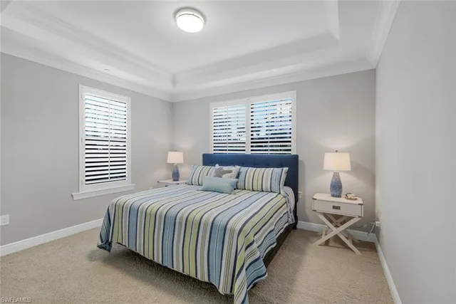 a bathroom with a granite countertop sink a mirror and a picture on the wall