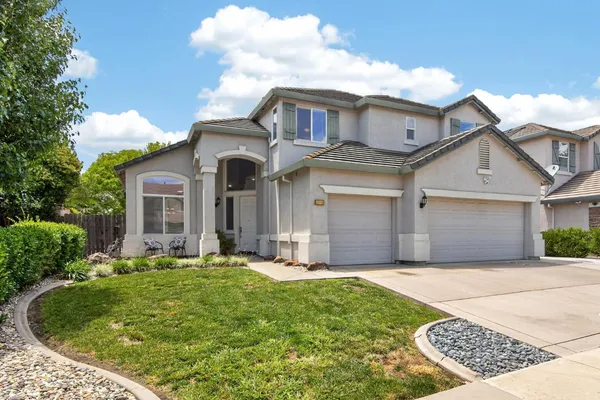 front view of a house with a yard