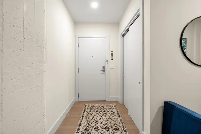a view of bathroom with a sink and a mirror