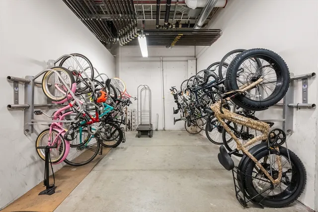 a view of parking garage with cars