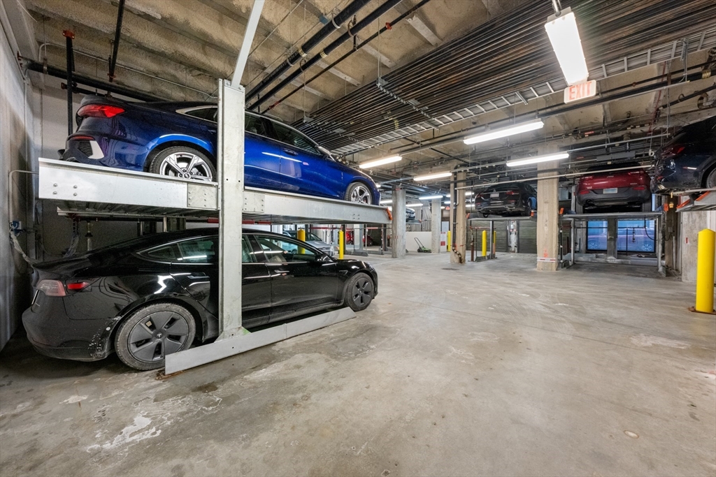 121-127 Portland Street, Unit 307 Boston, MA 02114 - Photo 22 of 27 a view of parking garage with cars