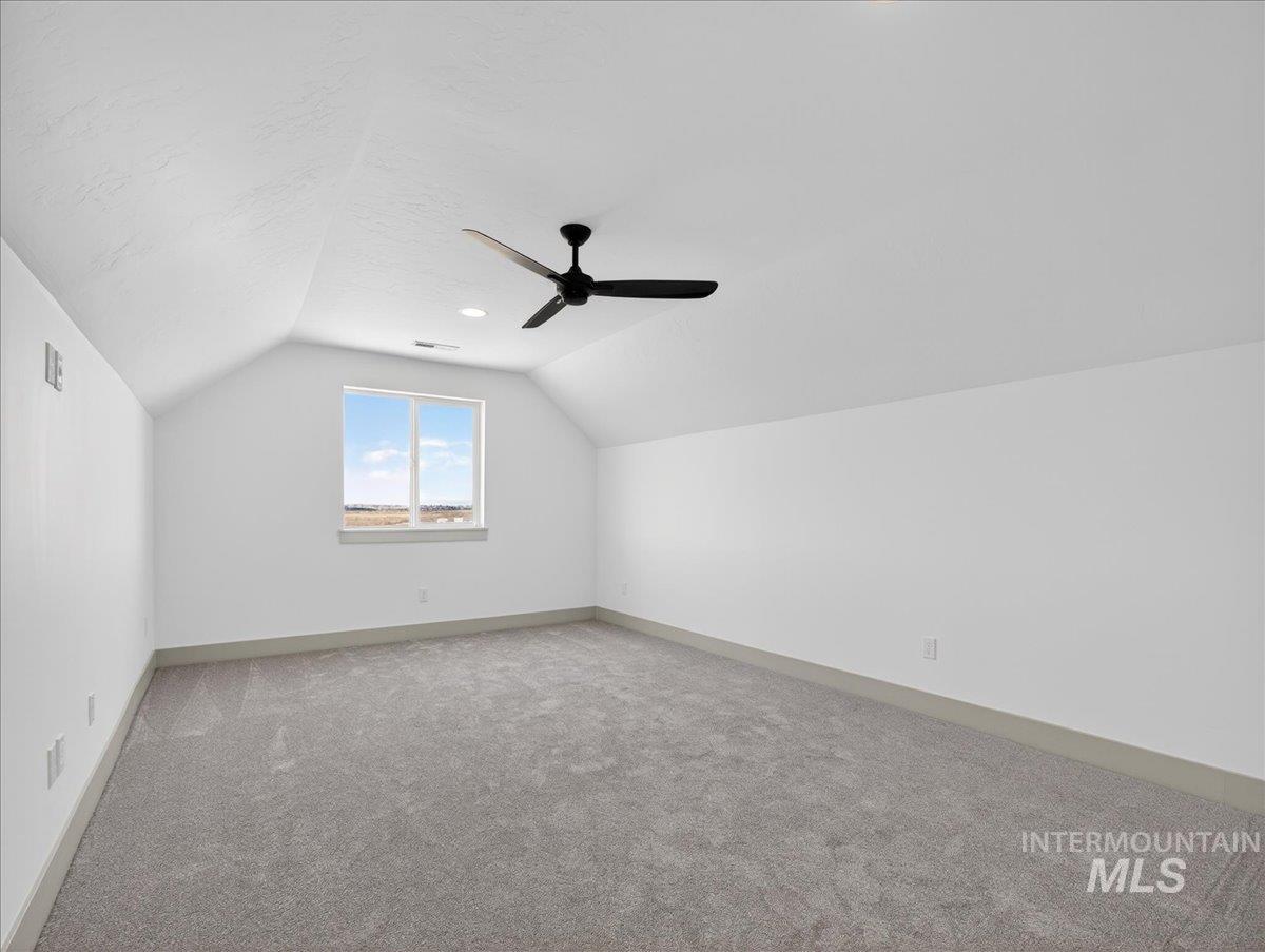 2240 Little Rock Road Emmett, ID 83617 - Photo 36 of 50 Bonus room with vaulted ceiling, light carpet, a ceiling fan, and a textured ceiling
