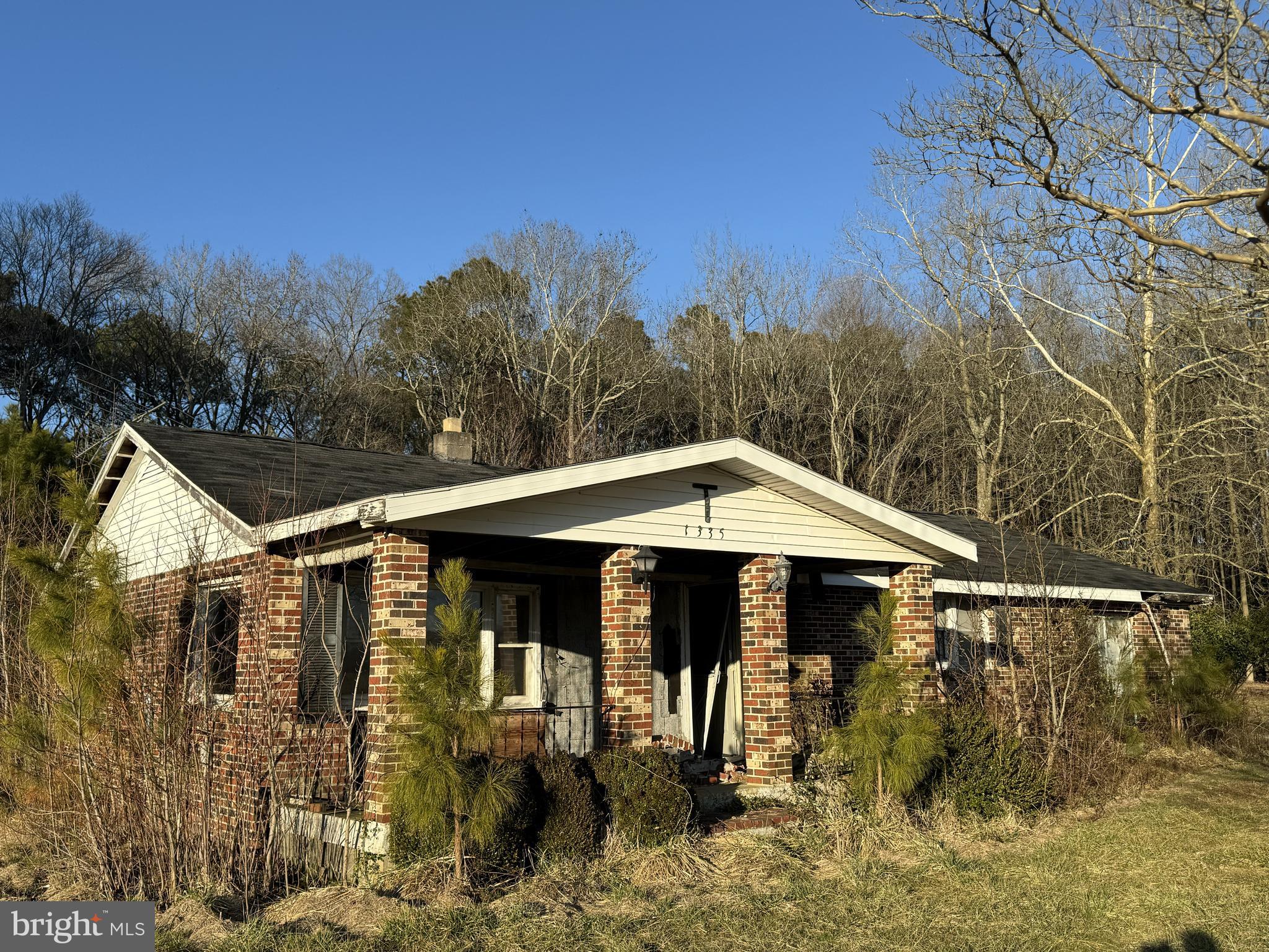 1335 Colona Road Pocomoke City, MD 21851 - Photo 1 of 5 a front view of a house with a yard