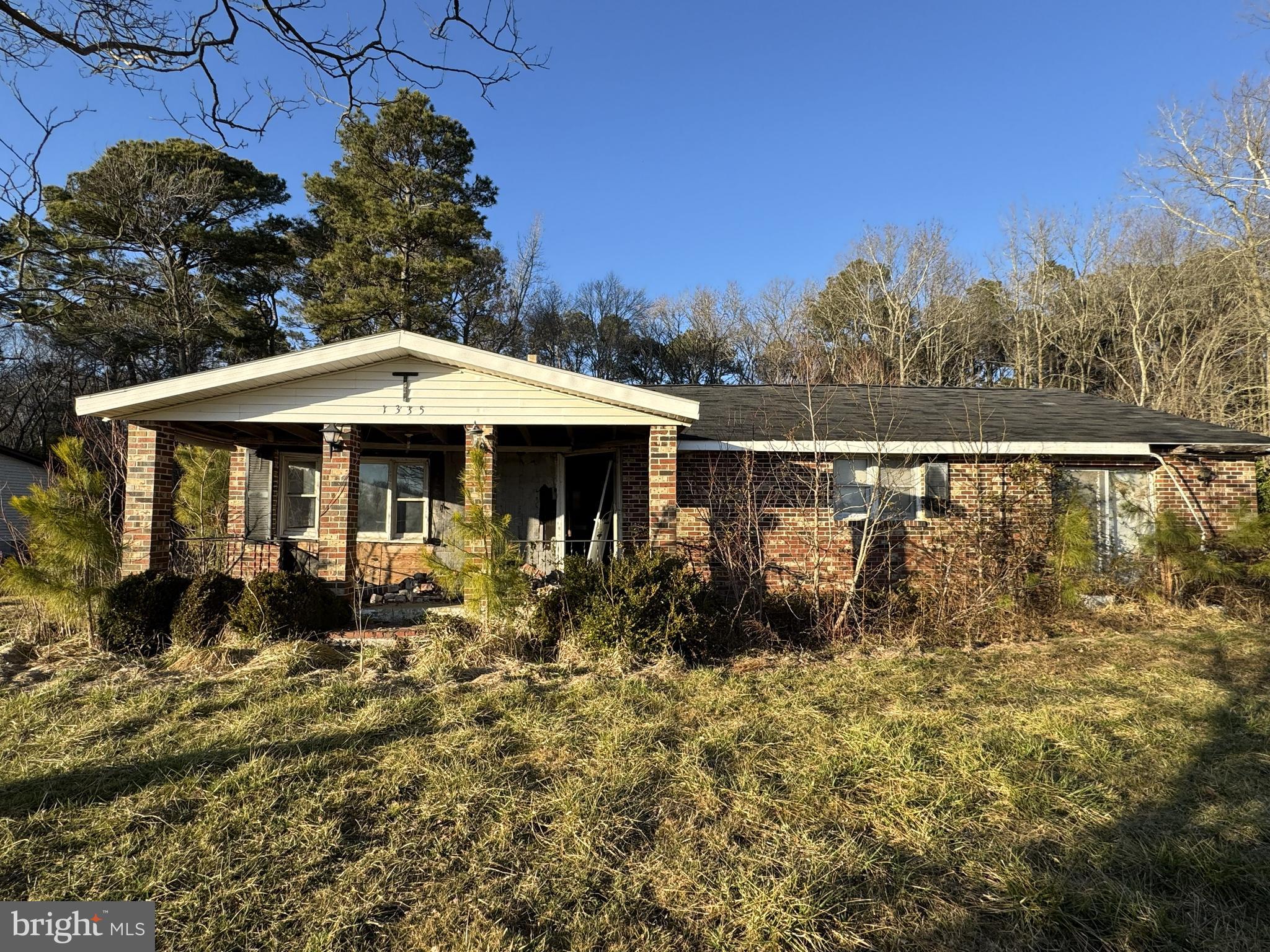 1335 Colona Road Pocomoke City, MD 21851 - Photo 2 of 5 a backyard of a house with table and chairs