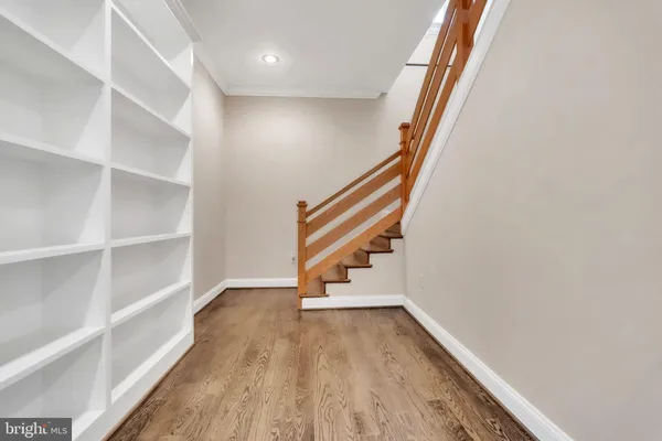 a view of entryway with wooden floor