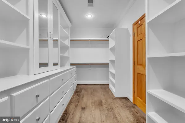 a hallway with cabinets