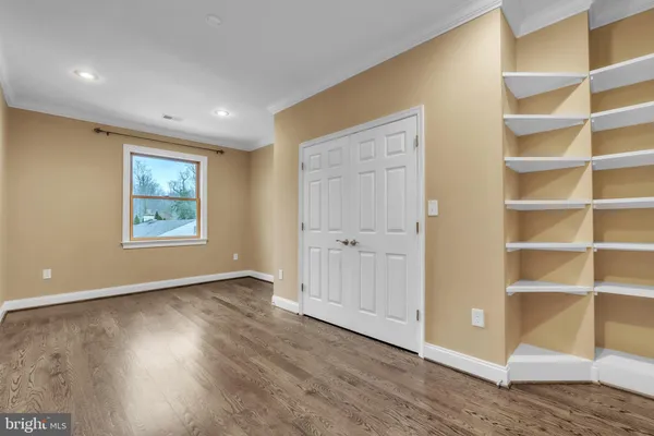 a view of an empty room and a window