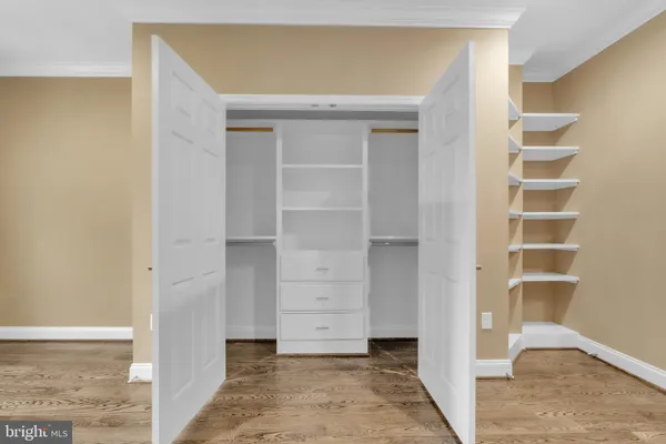 a view of closet area with empty racks