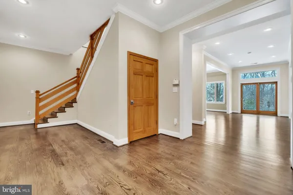 a view of an entryway with wooden floor