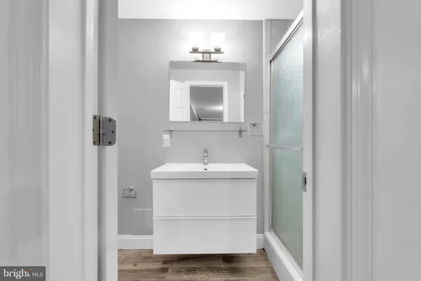 a view of a lake with couches and wooden floor