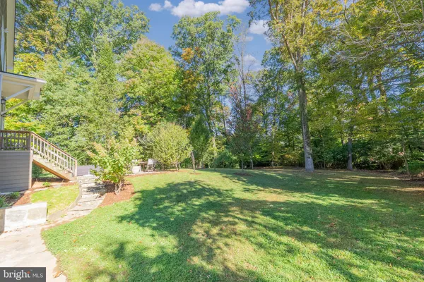 a swimming pool with trees in the background