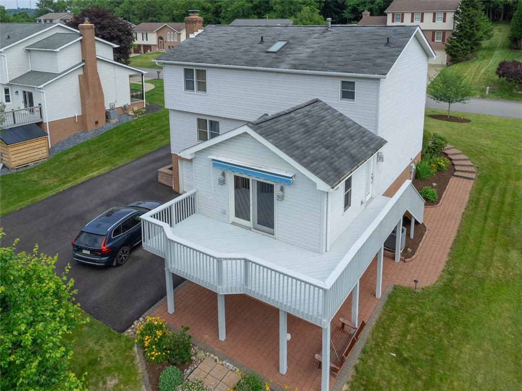 5 Kalyn Court Irwin, PA 15642 - Photo 3 of 40 Wrap around Rear deck and wrap around paver stone sidewalk and lower patio