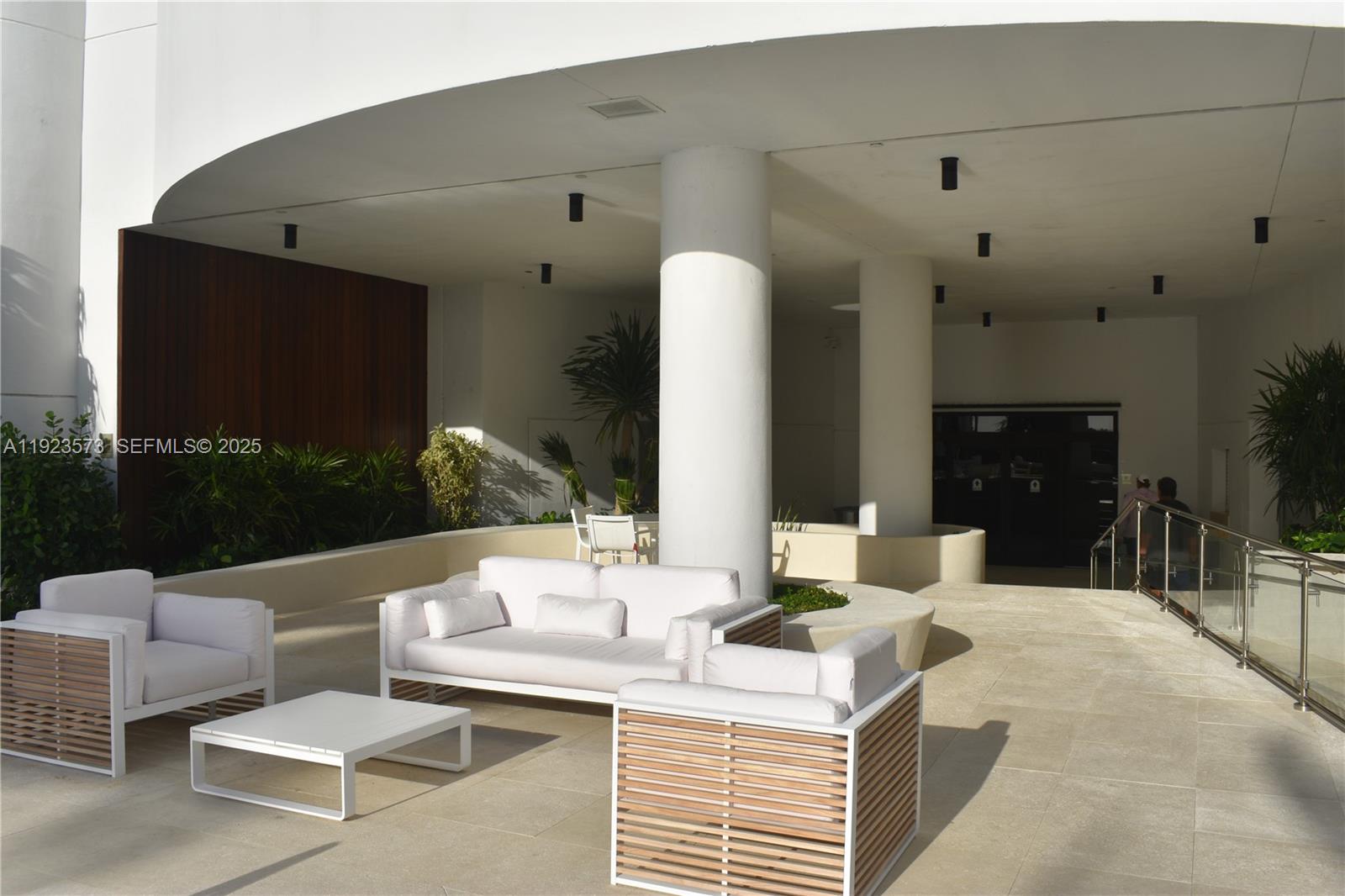 6365 Collins Avenue, Unit 3804 Miami Beach, FL 33141 - Photo 6 of 33 a living room with furniture and a fireplace