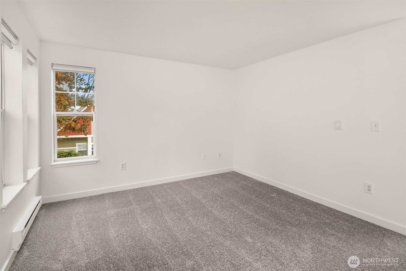 7711 Northeast 175th Street, Unit B210 Kenmore, WA 98028 - Photo 18 of 25 an empty room with windows