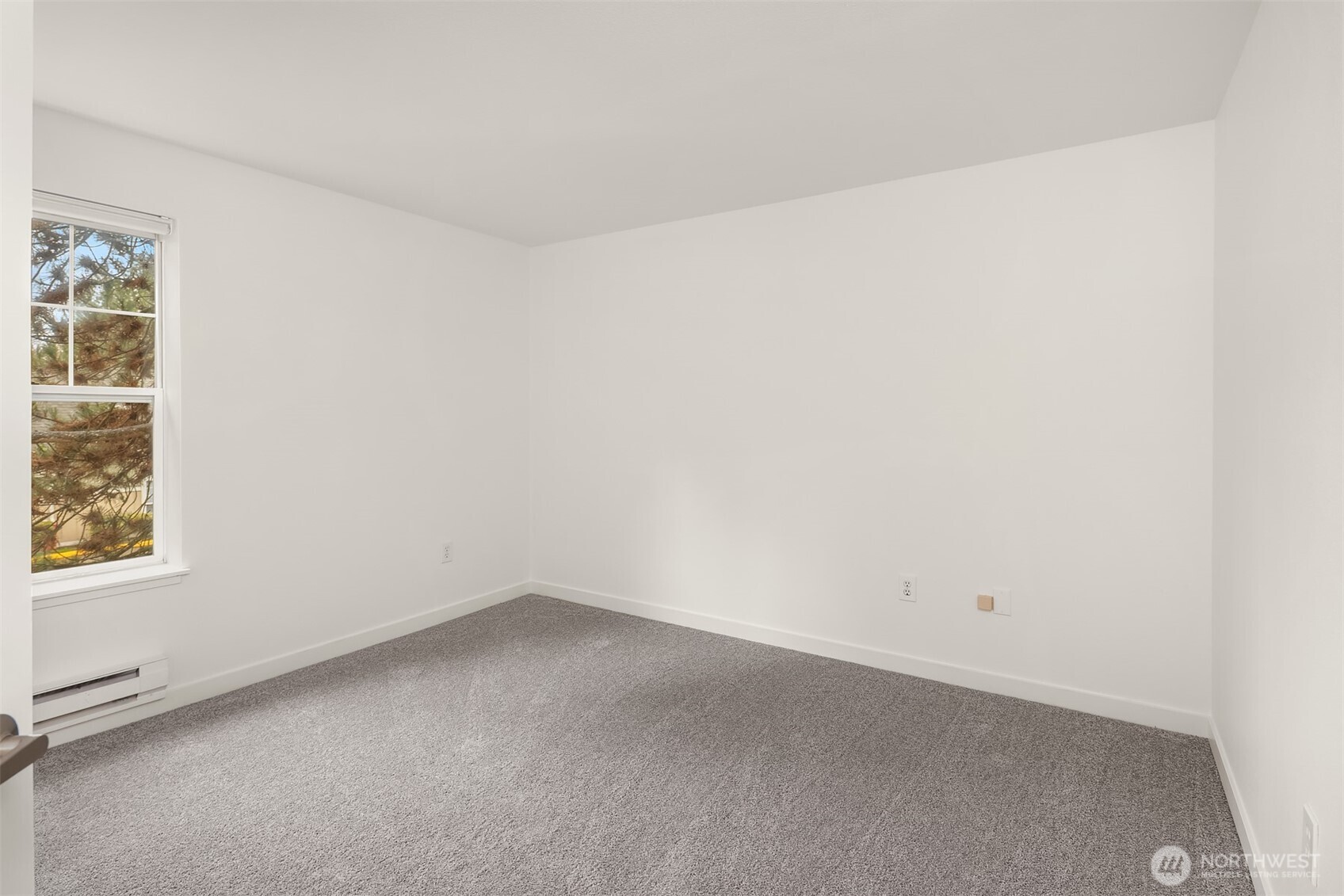 7711 Northeast 175th Street, Unit B210 Kenmore, WA 98028 - Photo 20 of 25 an empty room with windows