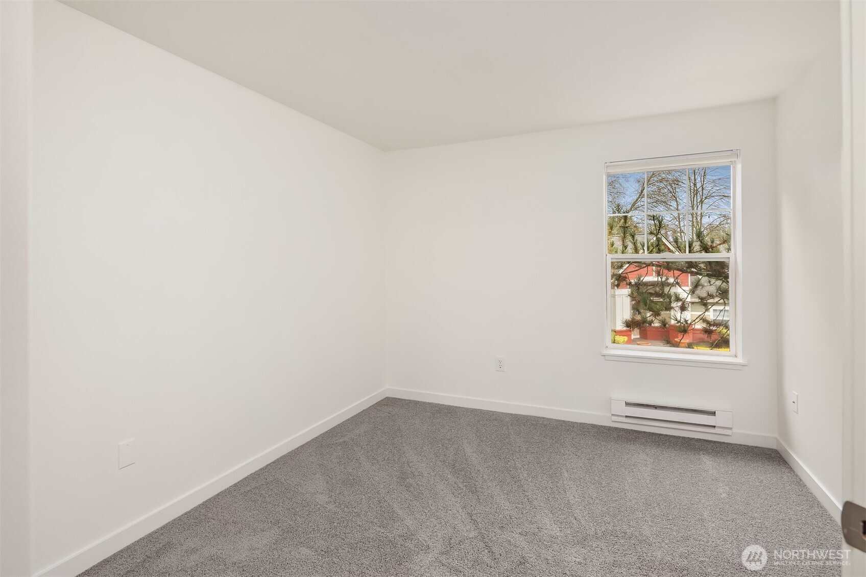 7711 Northeast 175th Street, Unit B210 Kenmore, WA 98028 - Photo 21 of 25 an empty room with a window