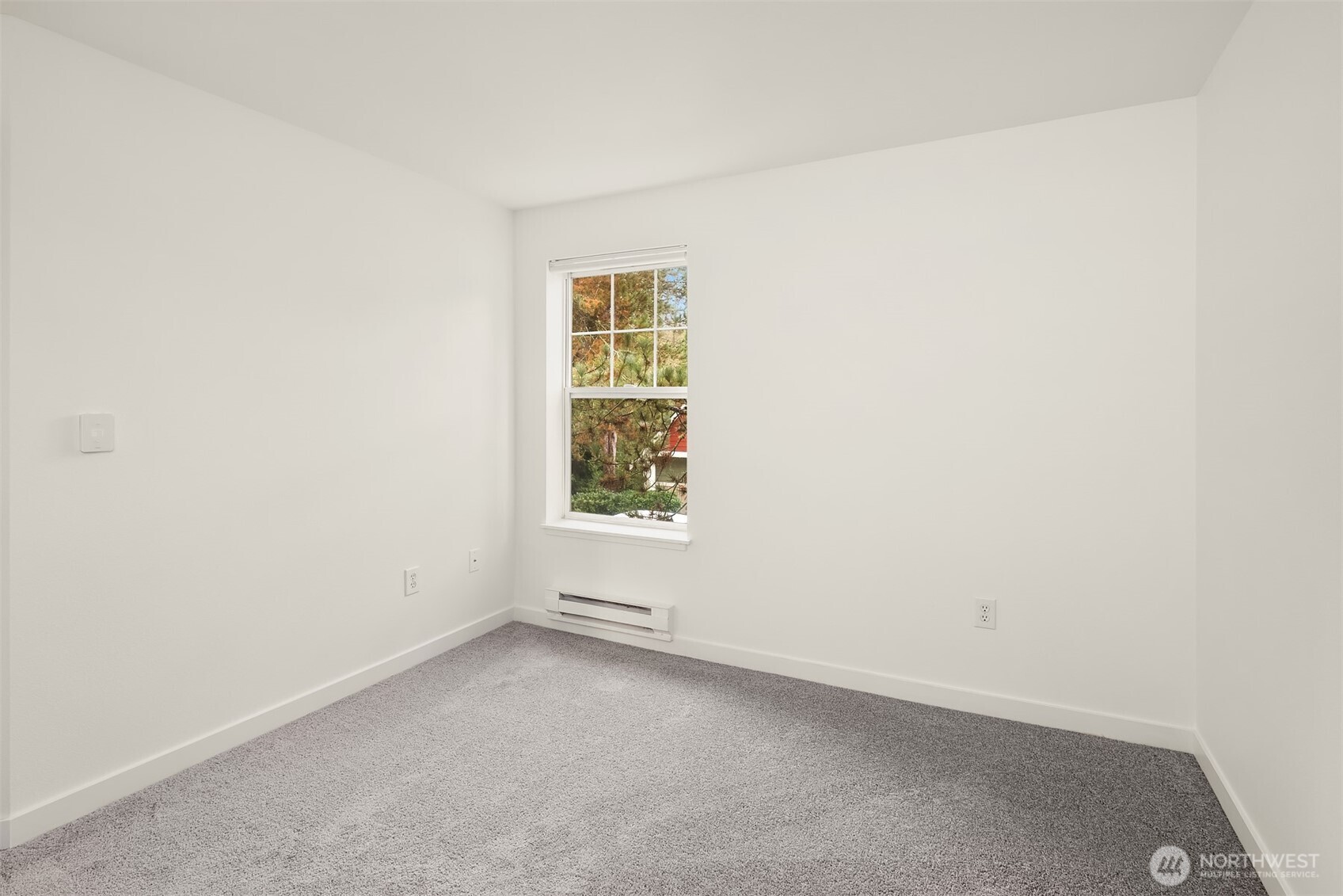 7711 Northeast 175th Street, Unit B210 Kenmore, WA 98028 - Photo 22 of 25 an empty room with a window