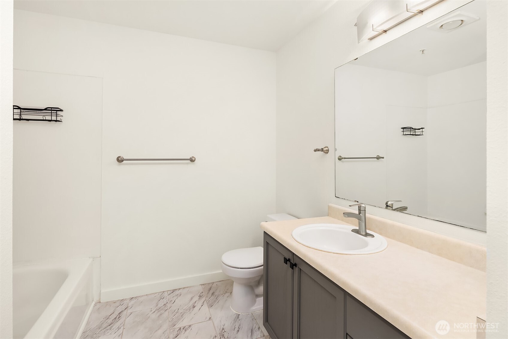 7711 Northeast 175th Street, Unit B210 Kenmore, WA 98028 - Photo 23 of 25 a bathroom with a sink and a toilet