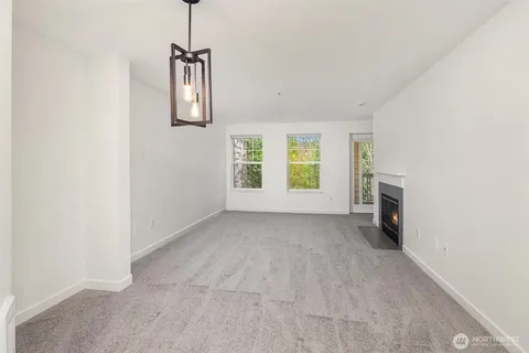 a kitchen with a refrigerator and a sink