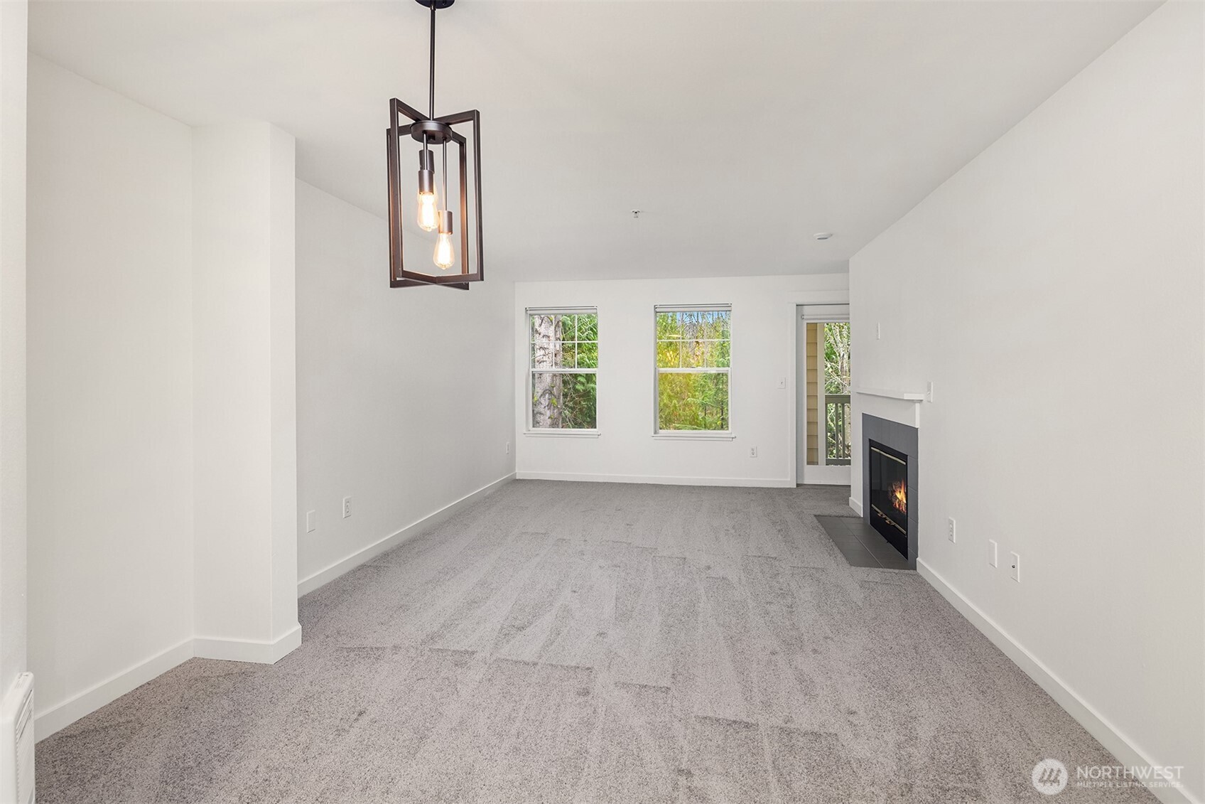 7711 Northeast 175th Street, Unit B210 Kenmore, WA 98028 - Photo 3 of 25 a view of livingroom with hardwood floor and a ceiling fan