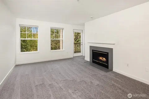 a view of empty room with a fireplace