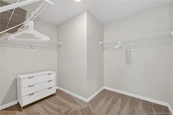 a bathroom with a double vanity sink and mirror