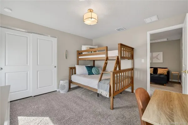 a bedroom with furniture and a window