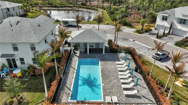 an aerial view of residential houses with outdoor space