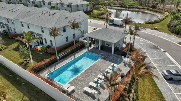 an aerial view of a house with a swimming pool