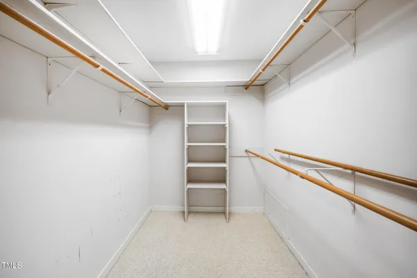 a bathroom with a sink a large mirror and a bathtub