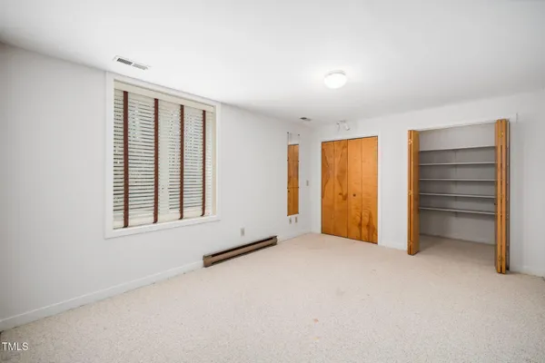 a balcony with wooden floor and fence