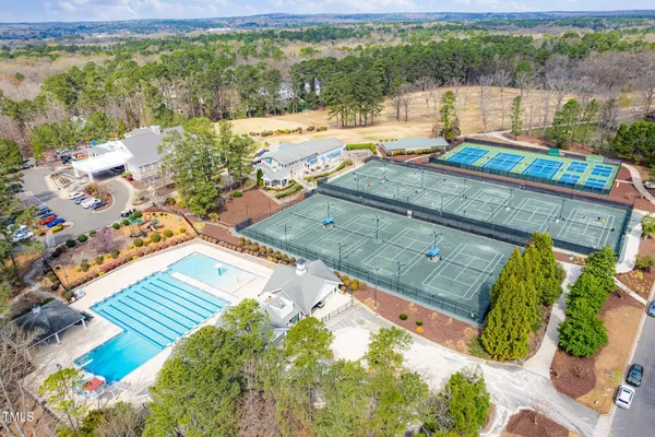 an aerial view of residential house with outdoor space and lake view