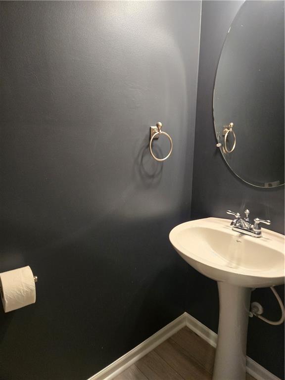 240 Ridge Mill Drive Acworth, GA 30102 - Photo 12 of 22 a bathroom with a sink a mirror and toilet