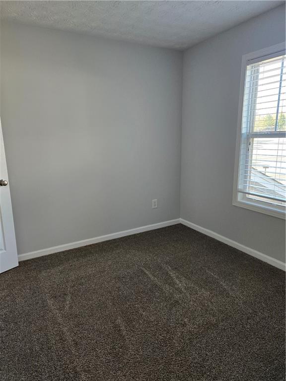 240 Ridge Mill Drive Acworth, GA 30102 - Photo 13 of 22 an empty room with a window
