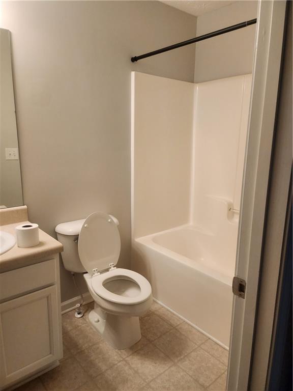 240 Ridge Mill Drive Acworth, GA 30102 - Photo 14 of 22 a white toilet sitting next to a bath tub