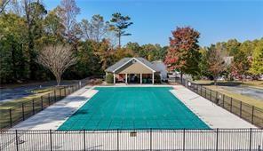 240 Ridge Mill Drive Acworth, GA 30102 - Photo 21 of 22 a house with swimming pool in front of it