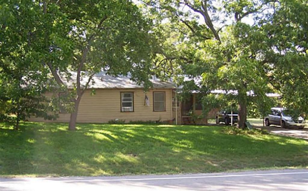 8829 Dalrock Road Rowlett, TX 75089 - Photo 6 of 7 View of front of property with a front yard
