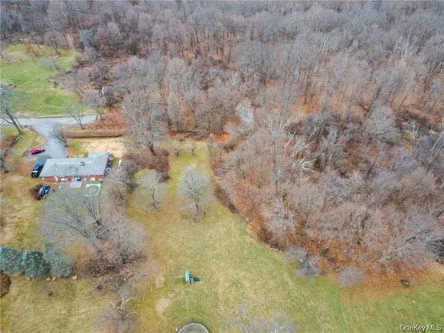 a bathroom with a granite countertop sink and vanity