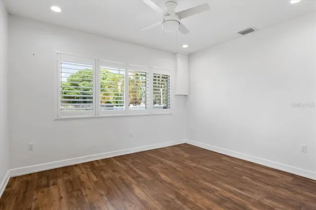 a kitchen with stainless steel appliances granite countertop a refrigerator a sink and a stove