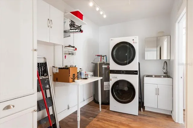 a kitchen with stainless steel appliances granite countertop a stove and a sink