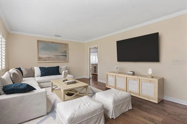 a living room with furniture and a table