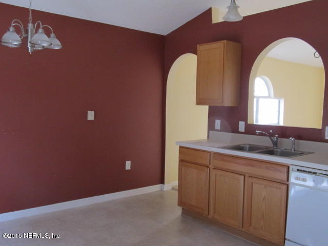 3488 Alec Drive Middleburg, FL 32068 - Photo 11 of 24 a bathroom with a granite countertop sink a vanity and a mirror