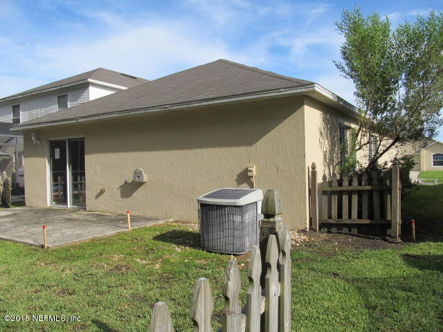 3488 Alec Drive Middleburg, FL 32068 - Photo 21 of 24 a front view of a house with garden