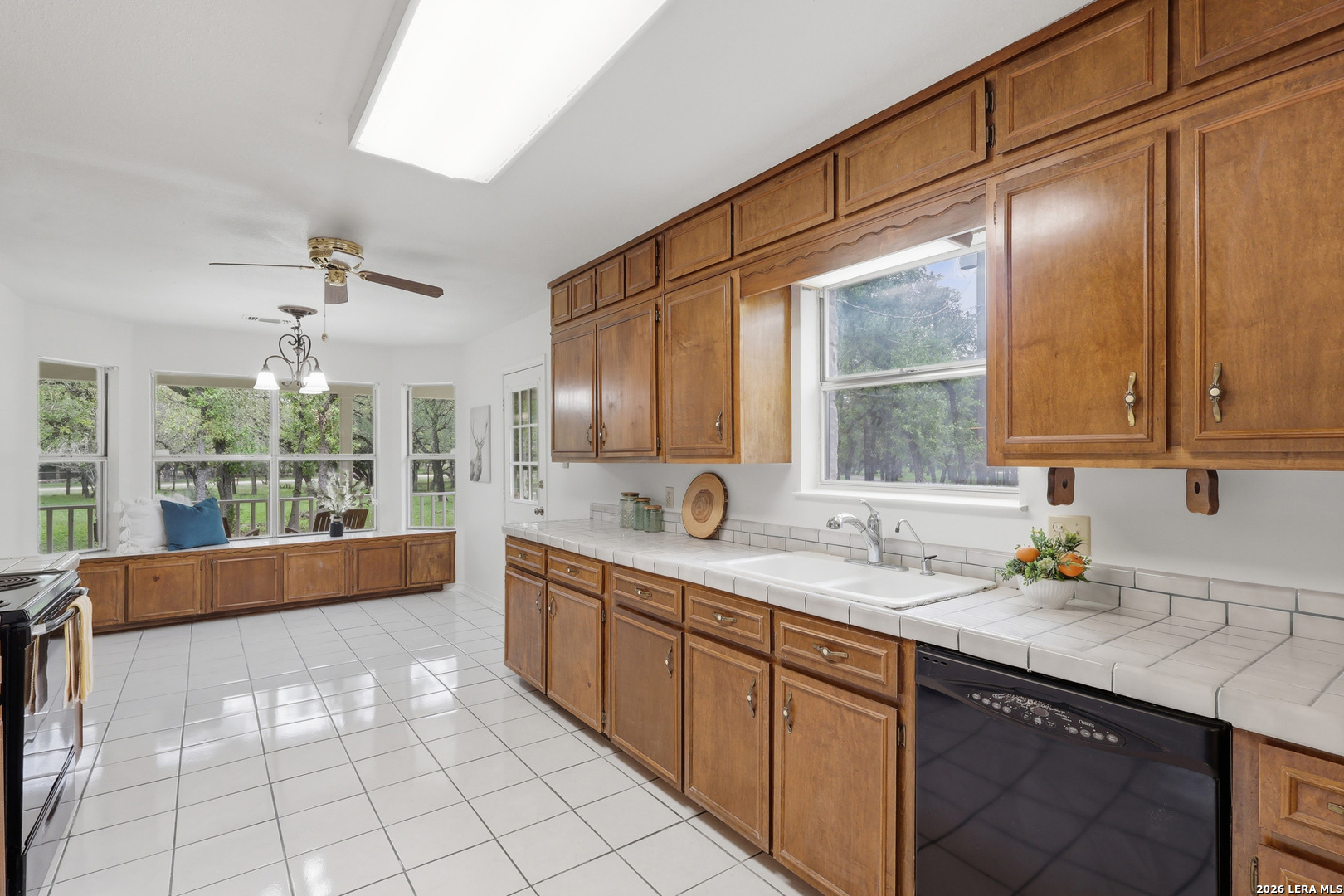 261 Fawn Lane Spring Branch, TX 78070 - Photo 14 of 44 a large kitchen with kitchen island a large window in it