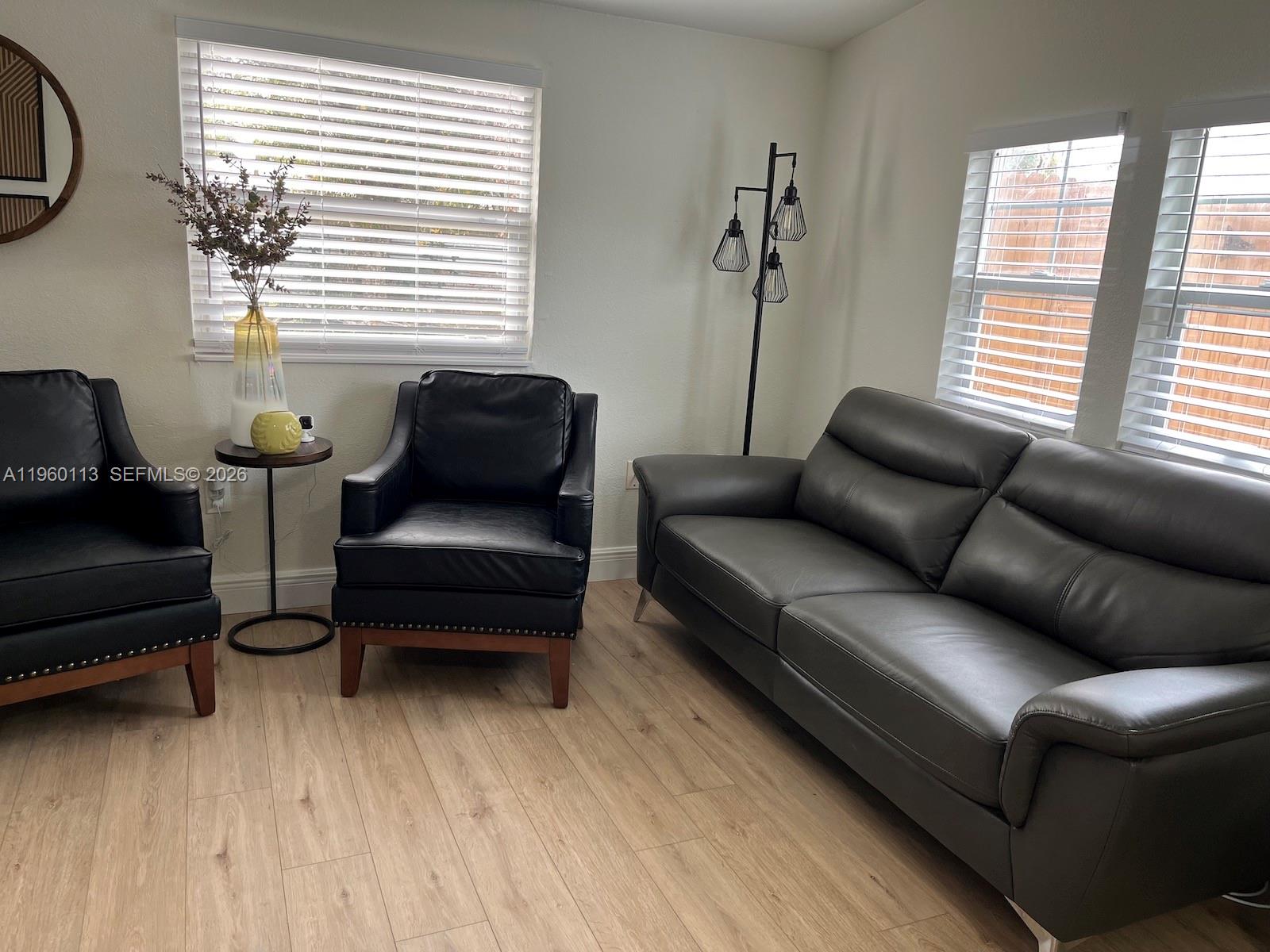 2253 Dordon Drive Melbourne, FL 32935 - Photo 11 of 40 a living room with furniture and a window