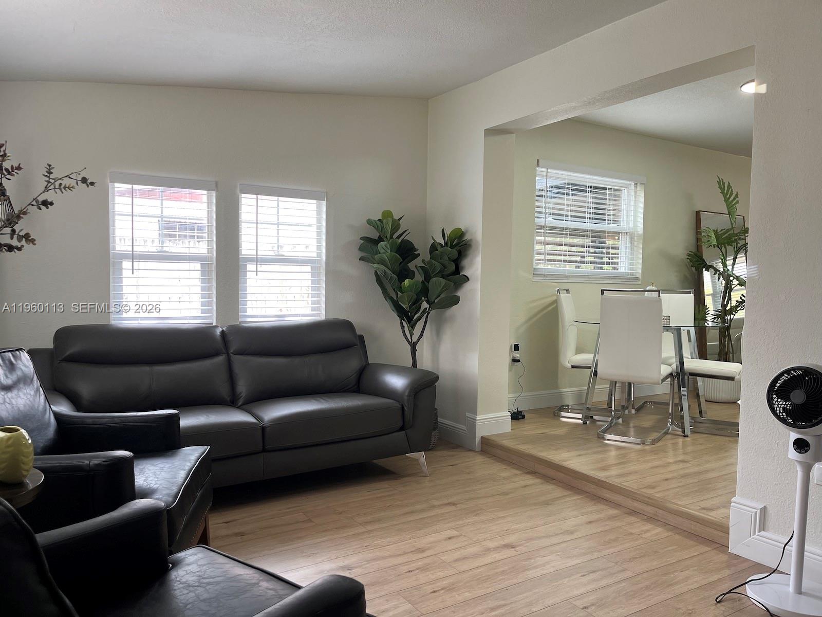 2253 Dordon Drive Melbourne, FL 32935 - Photo 13 of 40 a living room with furniture a table and a window