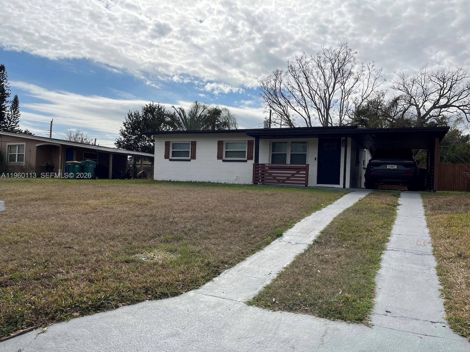 2253 Dordon Drive Melbourne, FL 32935 - Photo 2 of 40 a view of a house with a yard