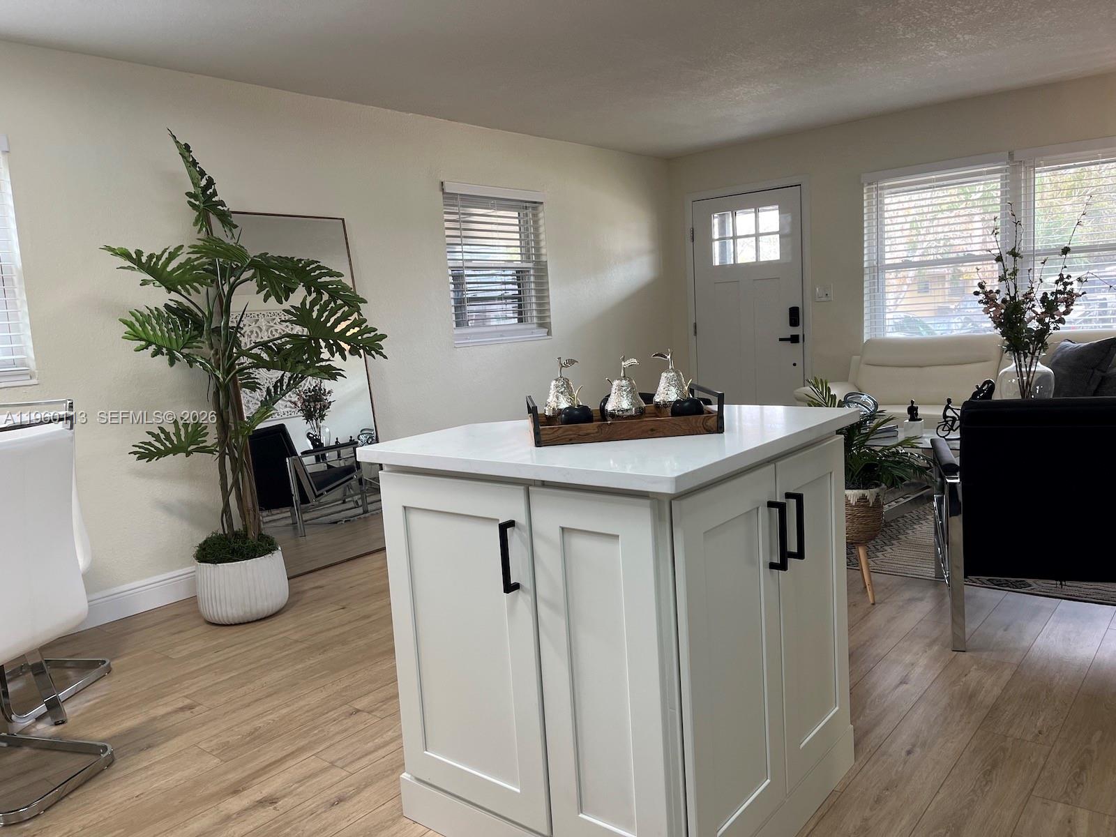 2253 Dordon Drive Melbourne, FL 32935 - Photo 22 of 40 a kitchen with a sink and dishwasher with wooden floor